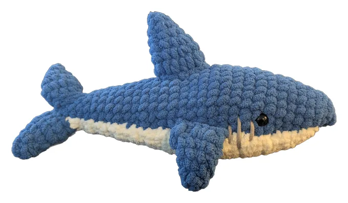 Blue crochet shark with a cream belly