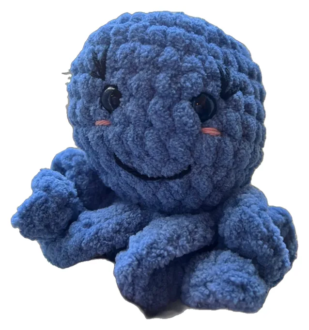 Navy crochet octopus with a big smile